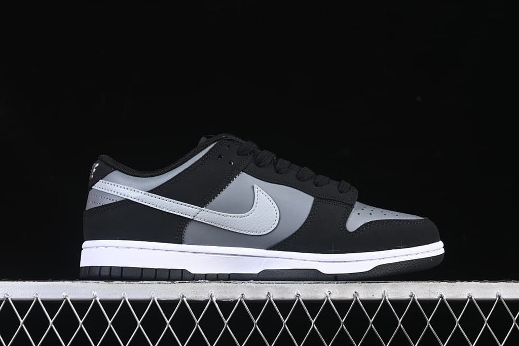 Side profile of a black, grey, and white low-top sneaker