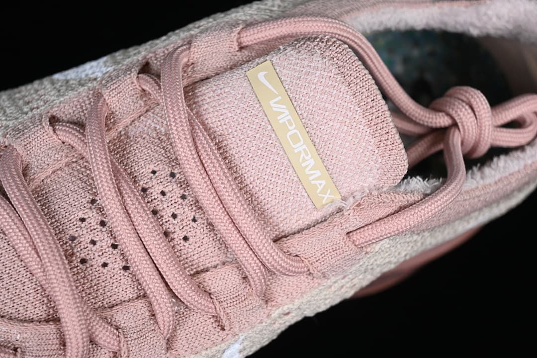 Close-up of the tongue branding and pink laces.