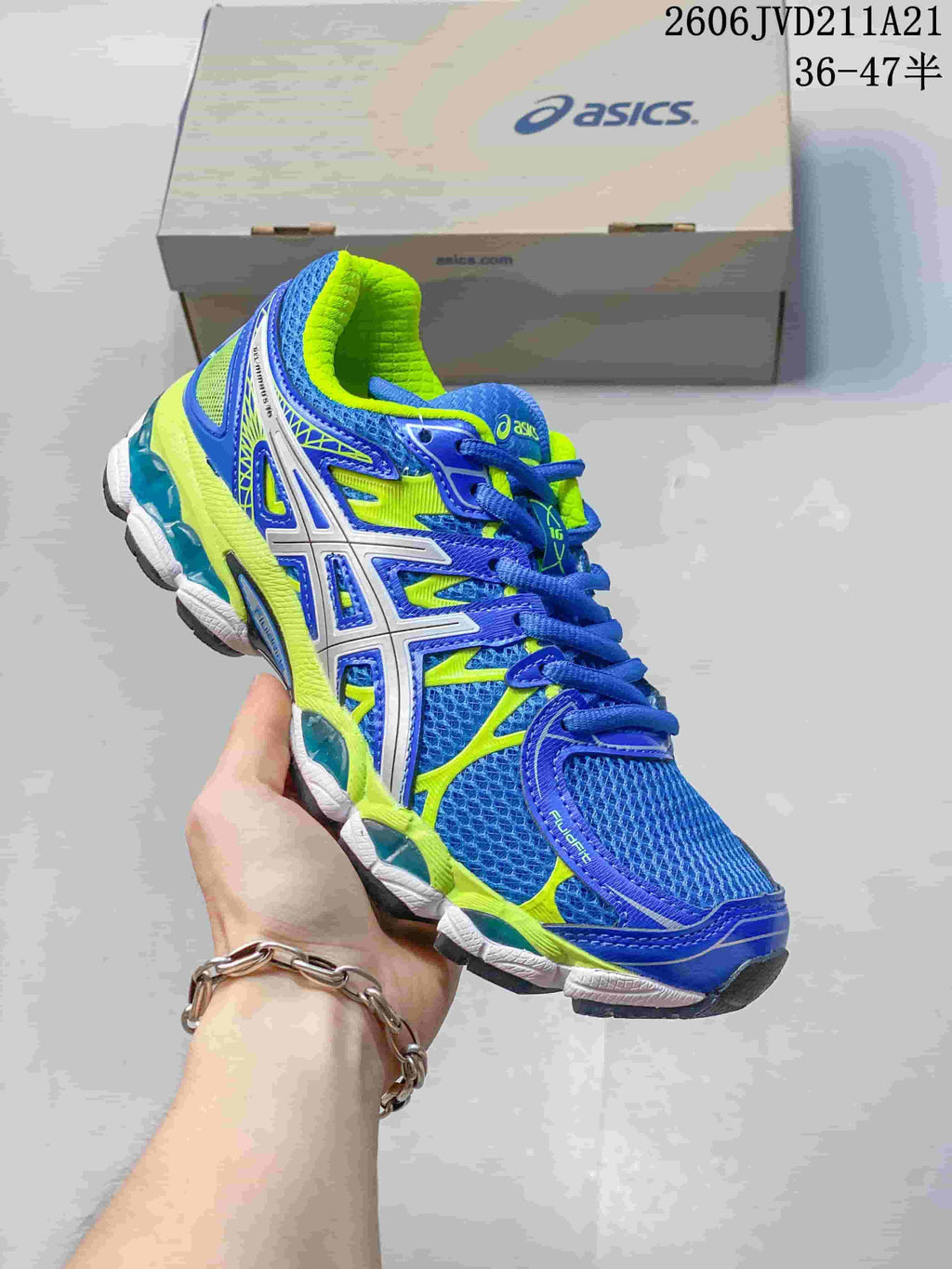 Angled view of the blue and lime shoe showing mesh panels, silver-tone side detailing and lime accents; image overlay states sizes 36–47.5.