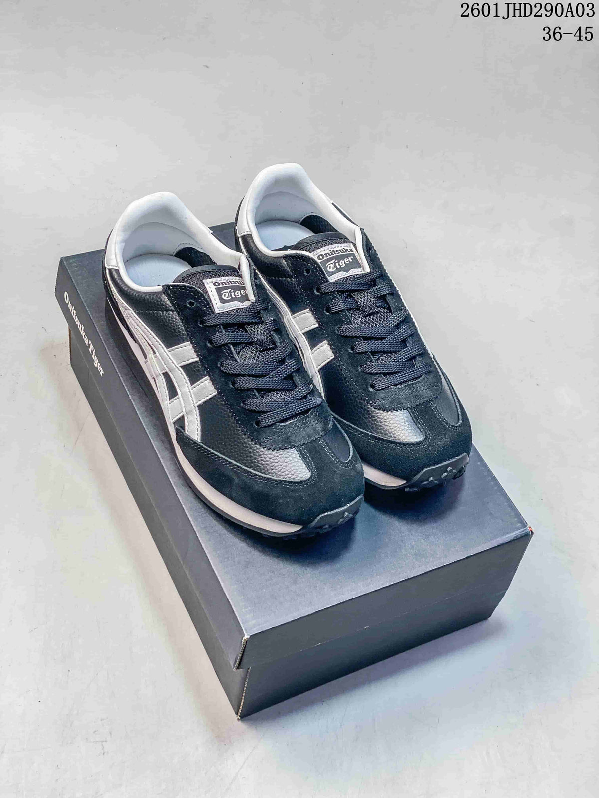 Pair of navy and silver Onitsuka Tiger EDR 78 sneakers on a branded shoe box