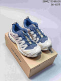Blue and off-white Salomon XT-3D trail shoes shown on a branded box