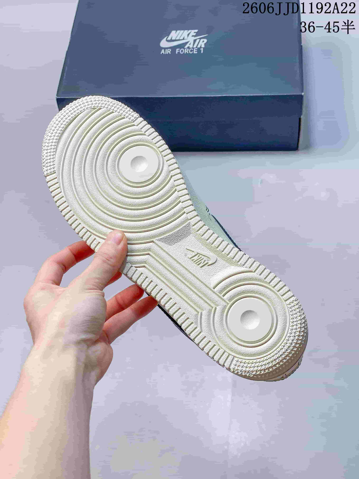Close-up of the sneaker outsole showing circular traction patterns