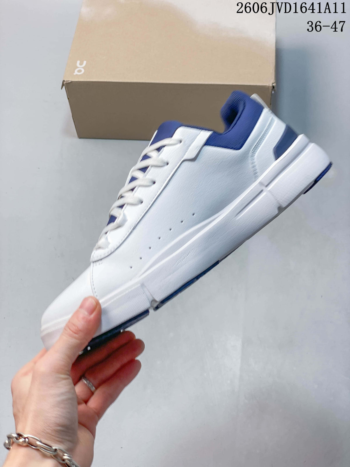 Side view of a white low-top sneaker with blue collar and heel accents.