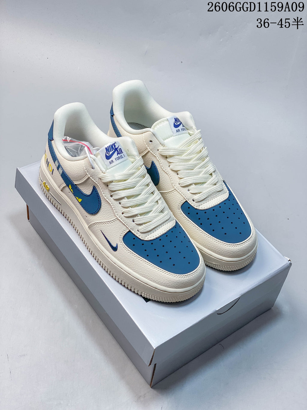 Off-white and blue low-top sneakers shown from the front on a shoe box