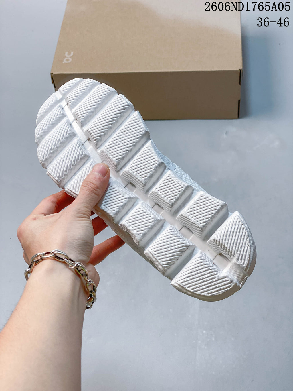 Close-up of the segmented outsole on a white On Cloud 5 sneaker