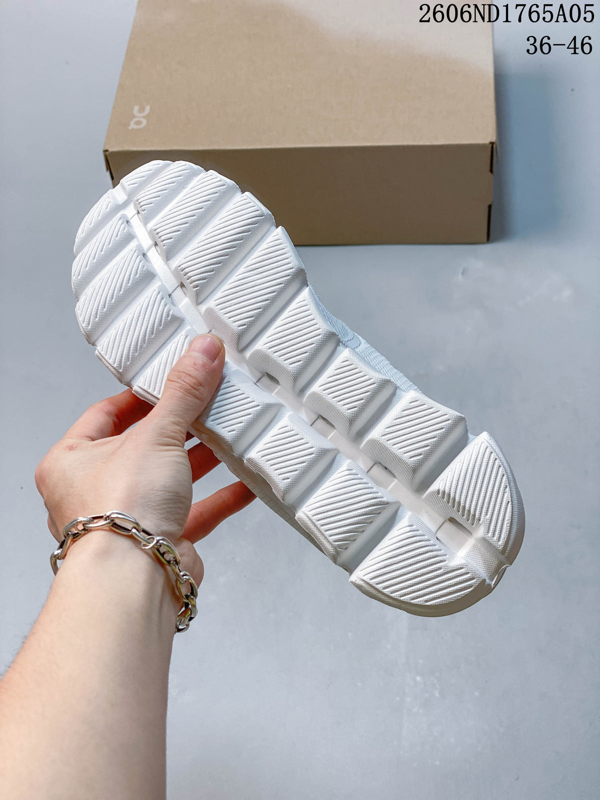 Close-up of the segmented outsole on a white On Cloud 5 sneaker