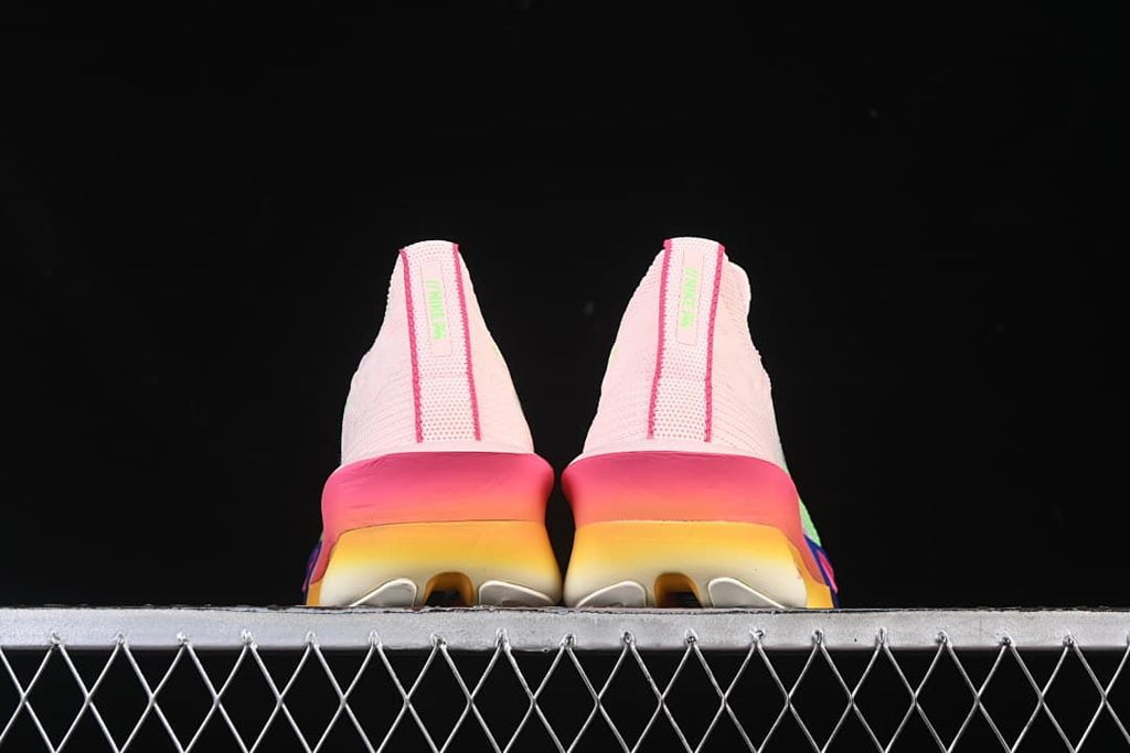Back view of both shoes with pink and yellow gradient soles
