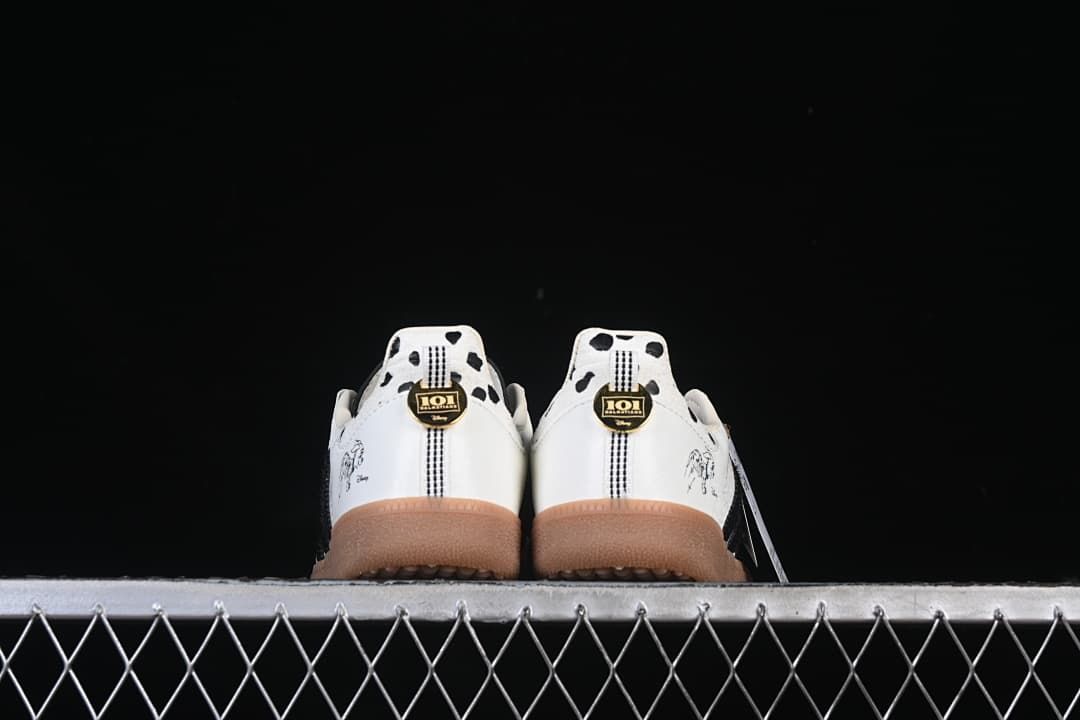 Rear view of both sneakers showing spotted heel panels and gum-colored soles.