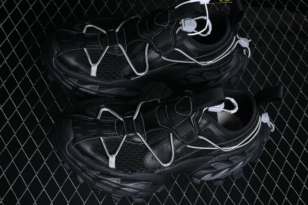 Pair of black trail sneakers viewed from above.