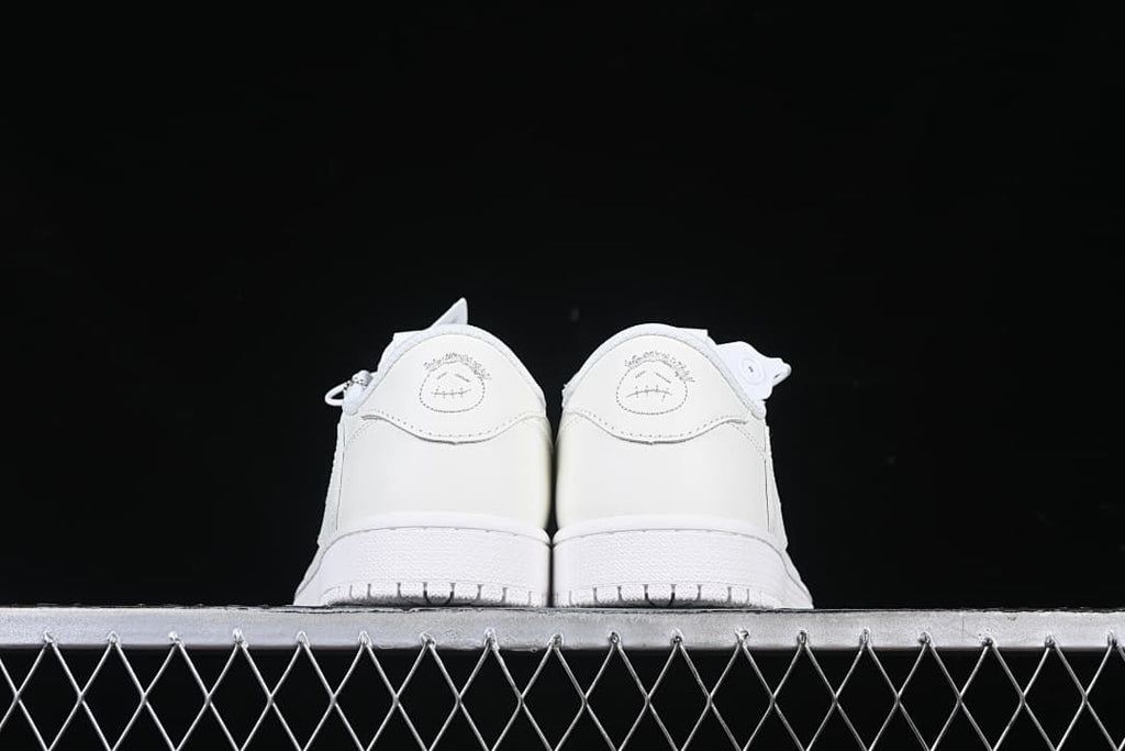 Rear view of both sneakers showing heel graphics.