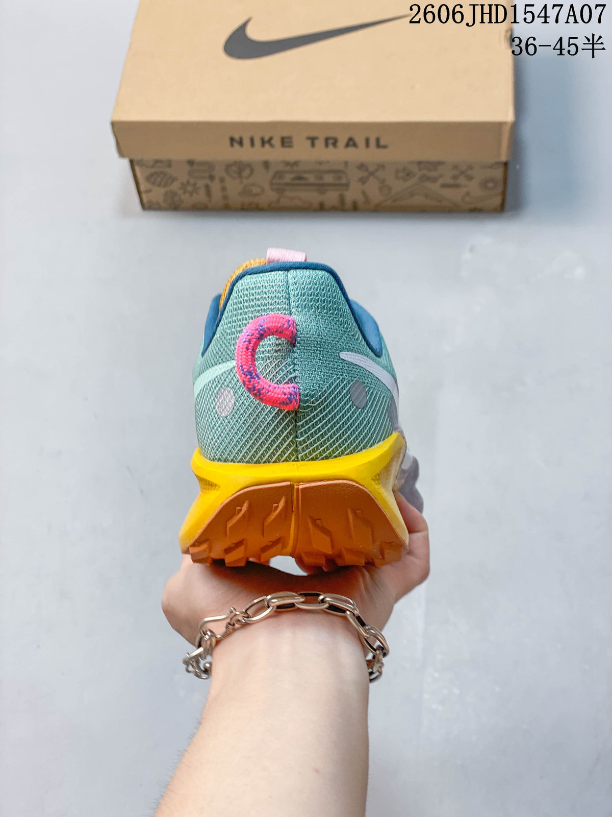 Rear view of a teal Nike ReactX Pegasus Trail 5 shoe showing the heel and outsole.
