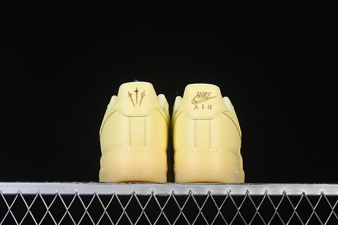 Rear view showing heel embroidery on both sneakers