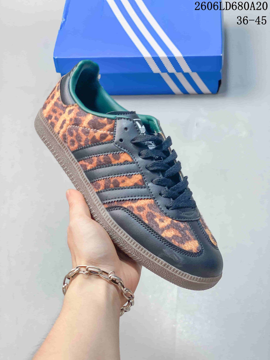 Angled side view of the leopard-print adidas Samba OG sneaker