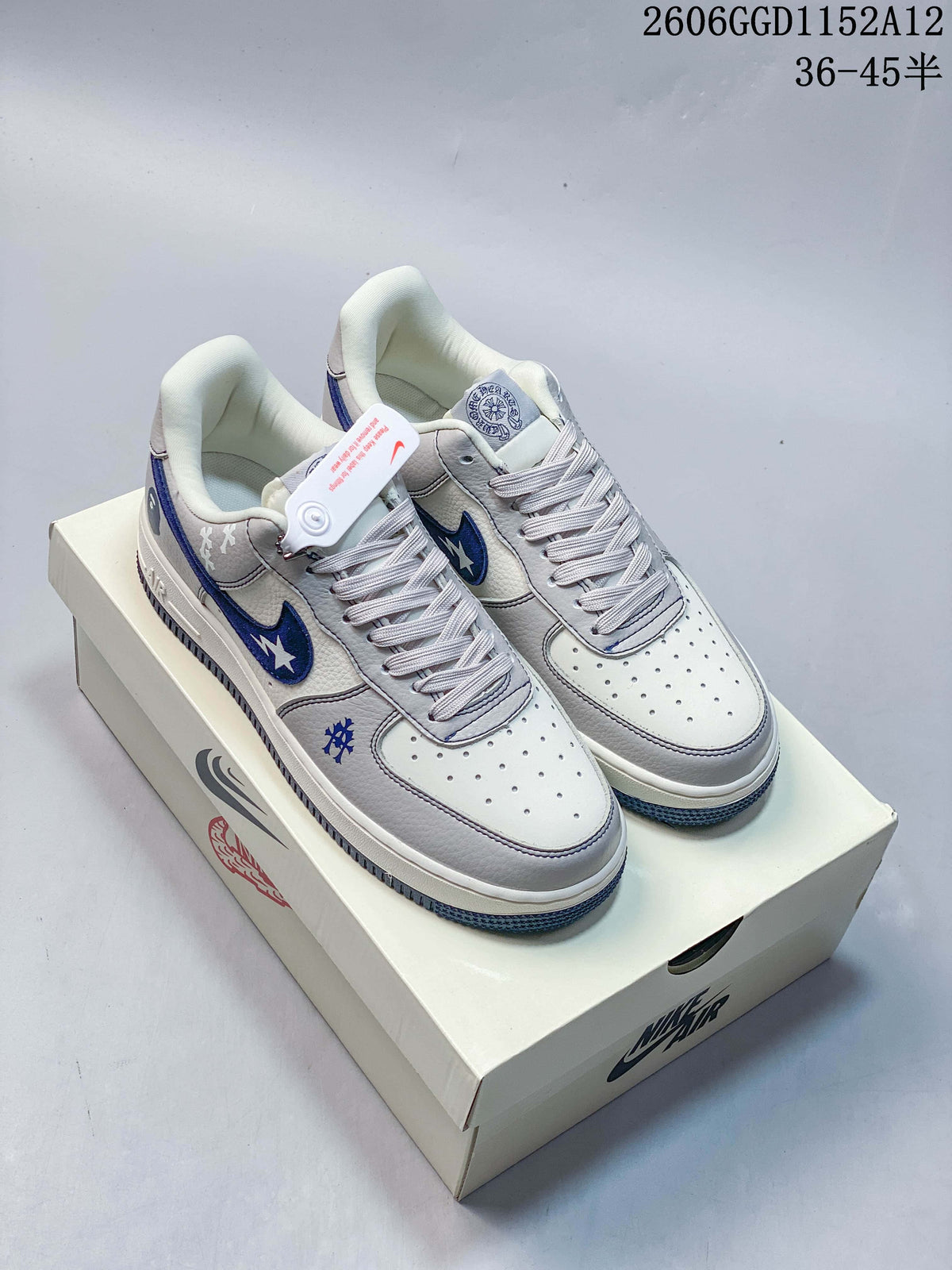 Pair of off-white and light gray Nike Air Force 1 low-top sneakers with navy blue accents, shown on a box