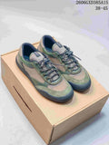 Green mesh-panel low-top sneakers with contrasting overlays on a box