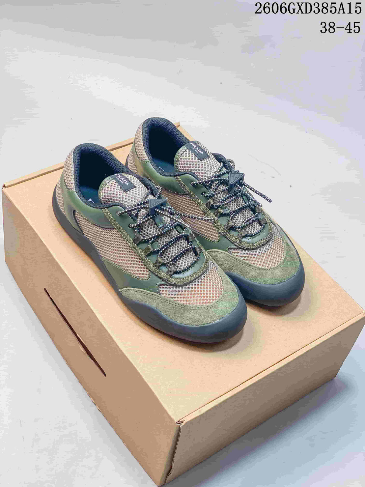 Green mesh-panel low-top sneakers with contrasting overlays on a box