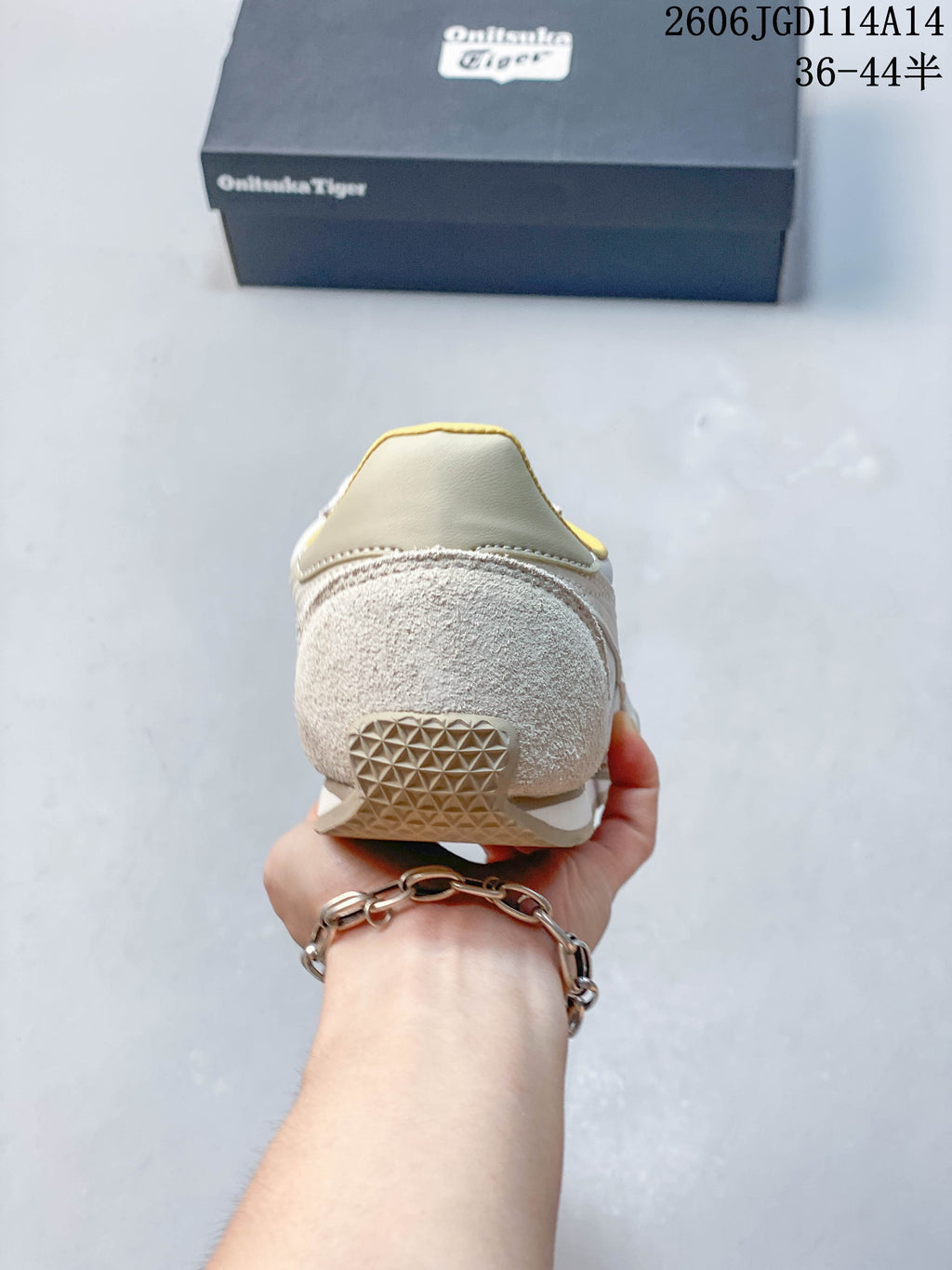 Rear view showing the textured heel panel and pale yellow lining