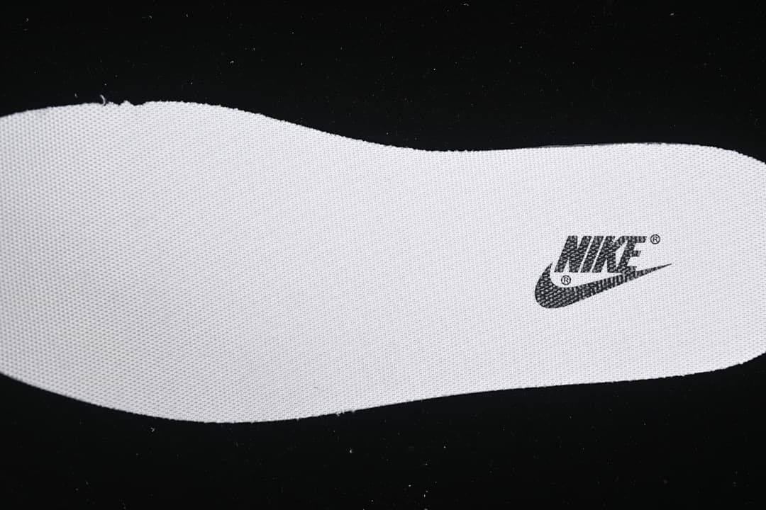 Close-up of a white insole with a Nike logo