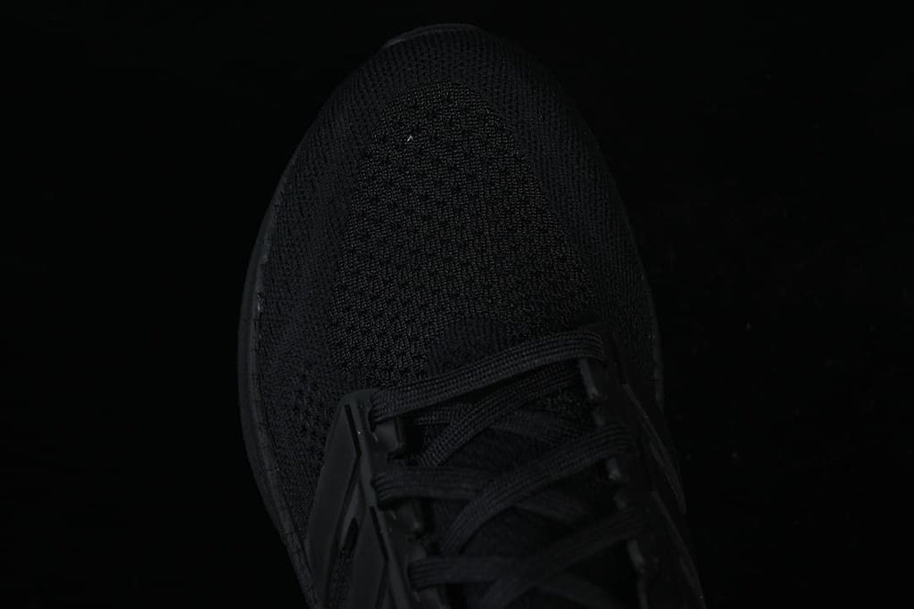 Top view of the black knit-look toe and laces.