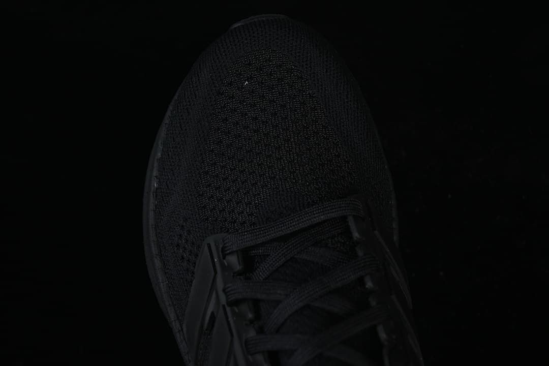 Top view of the black knit-look toe and laces.