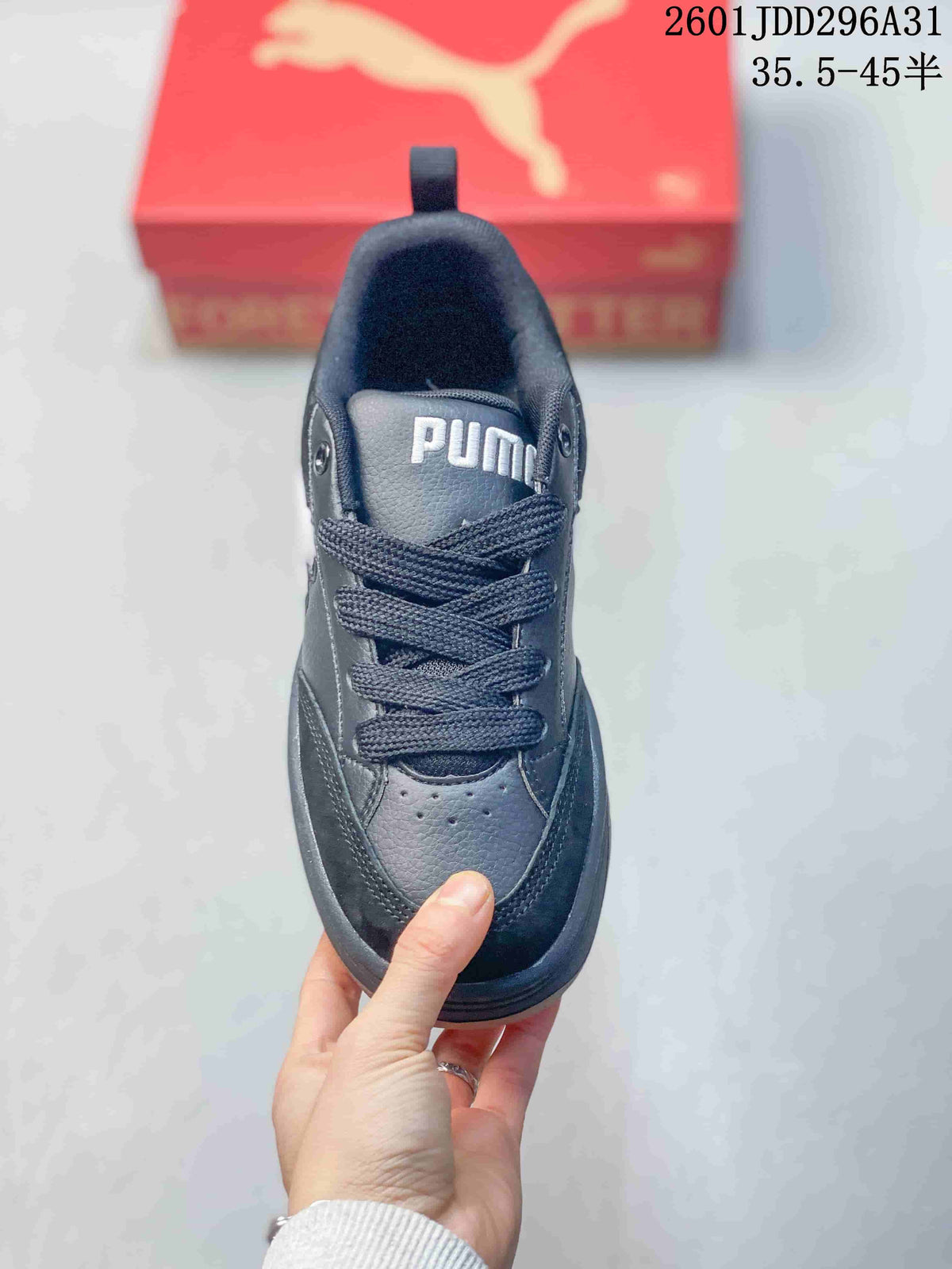 Top view of a dark lace-up sneaker with a padded collar and perforated toe area