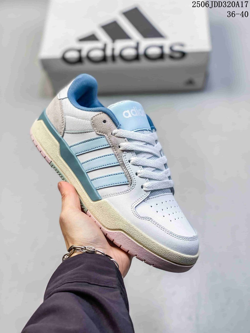 Angled view of the white and light blue adidas Entrap sneaker.
