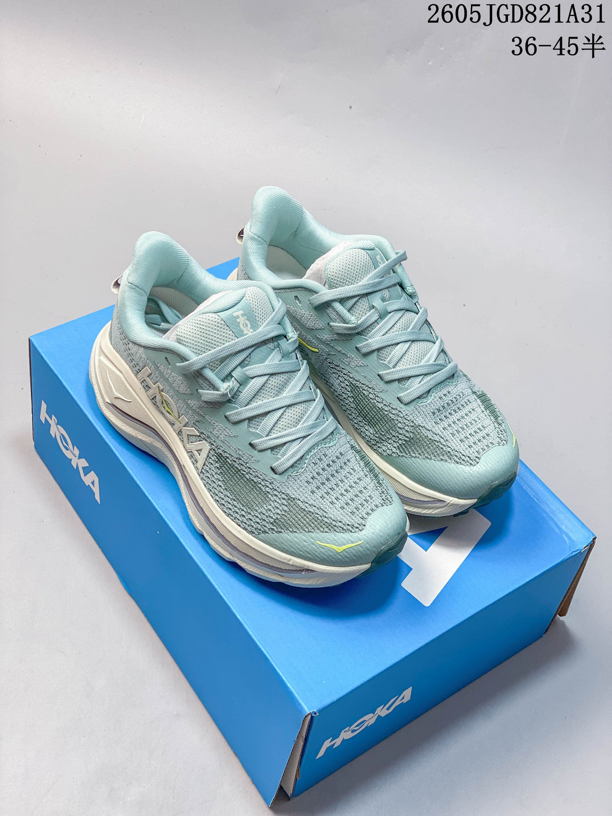 Pair of light blue HOKA Challenger 8 running shoes on a blue shoe box