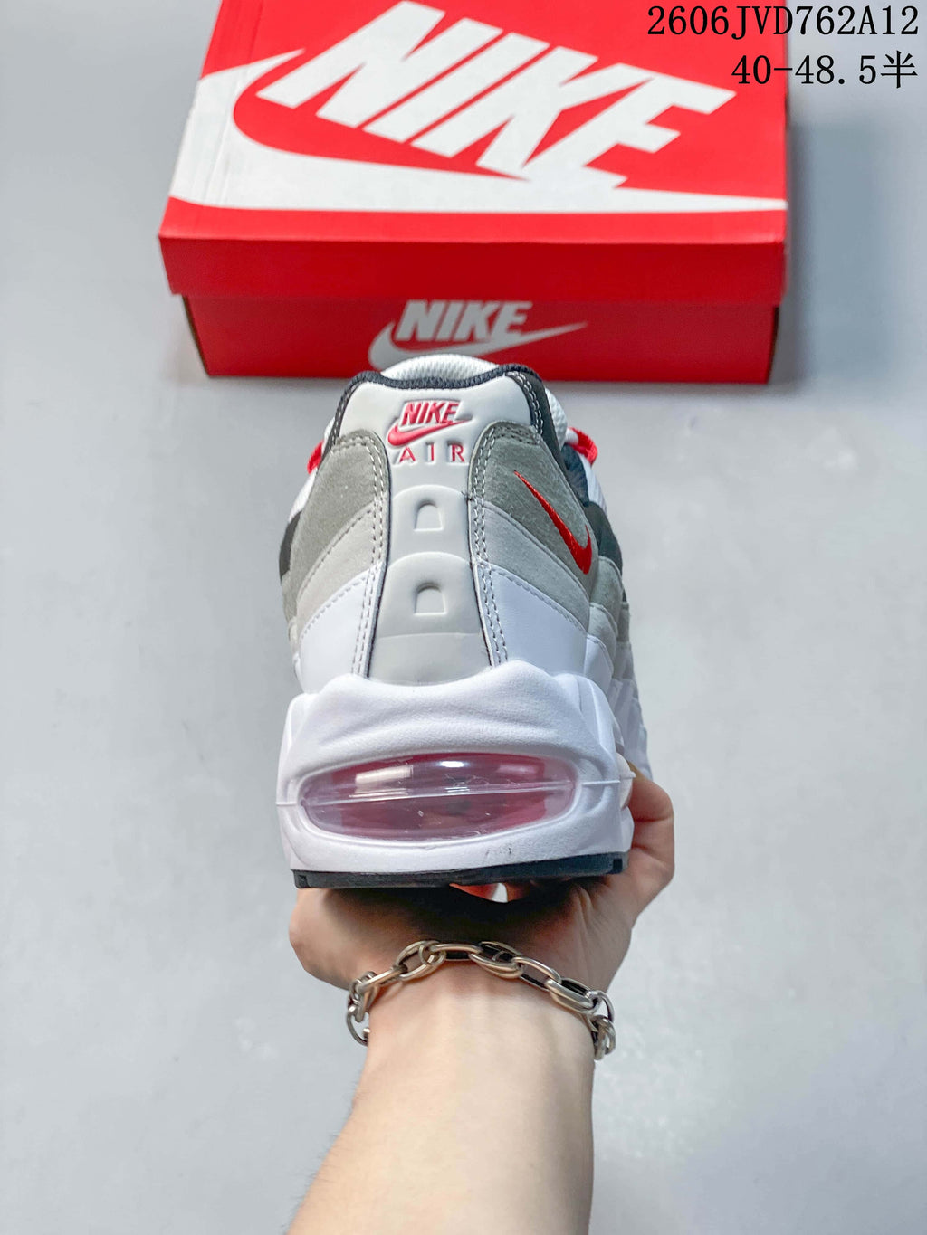 Rear view of a Nike Air Max 95 OG sneaker showing the heel and visible cushioning window.