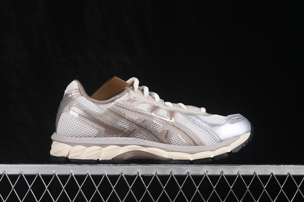 Side profile highlighting the breathable-looking mesh panels, tonal overlays, and layered sole.