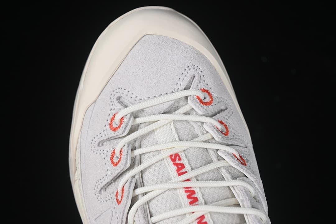 Top-down detail of the toe and red-accented lace loops