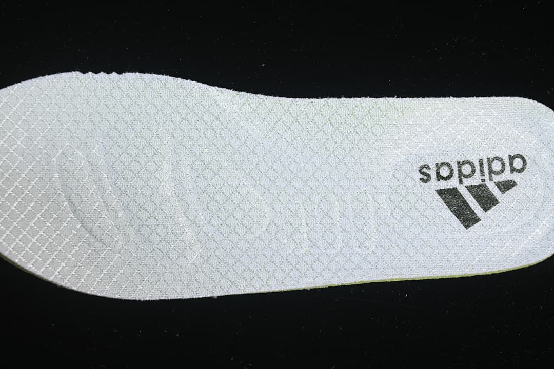 Textured shoe insert with adidas branding