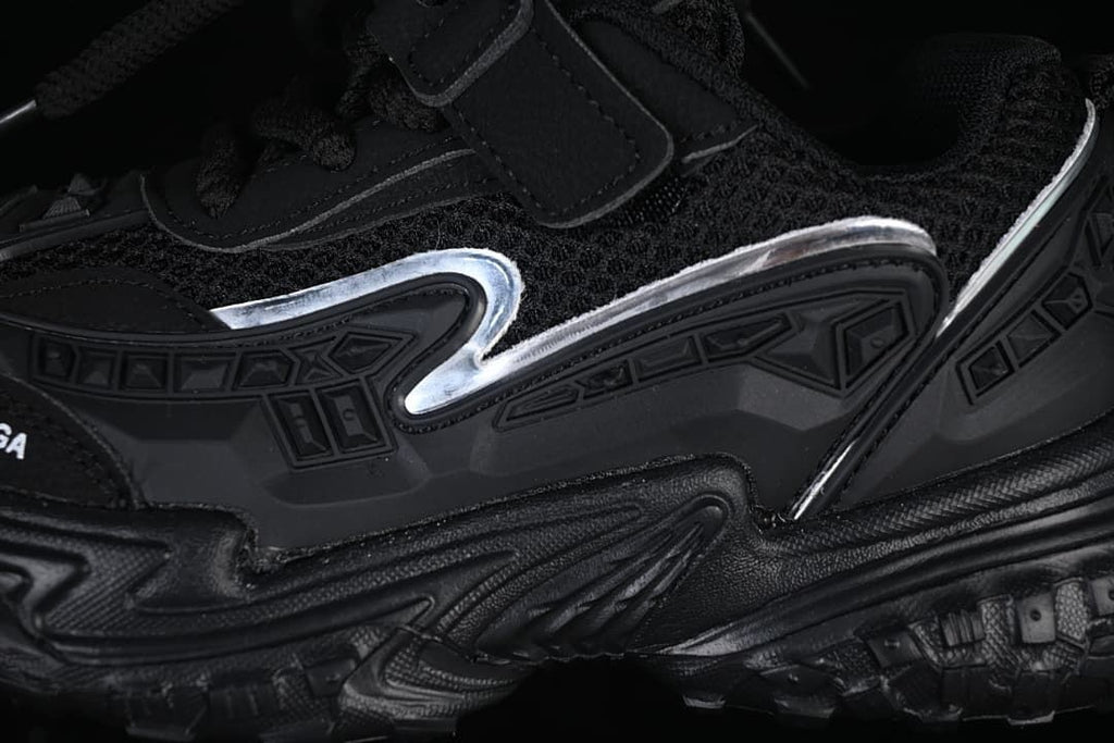 Close-up of the sneaker's side panels, decorative accents, and layered sole.