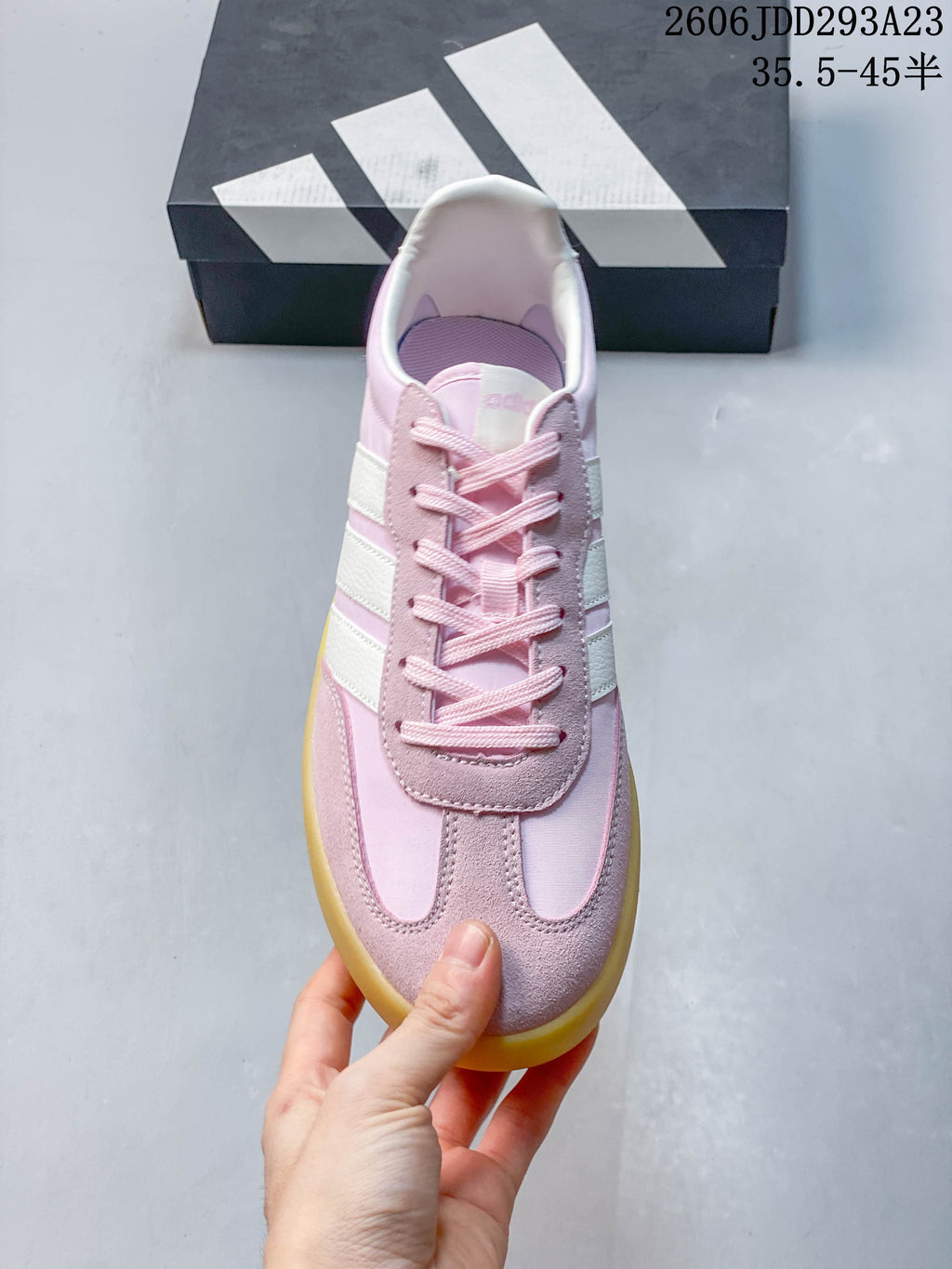 Top view of the sneaker showing its laces and pink-and-white panels