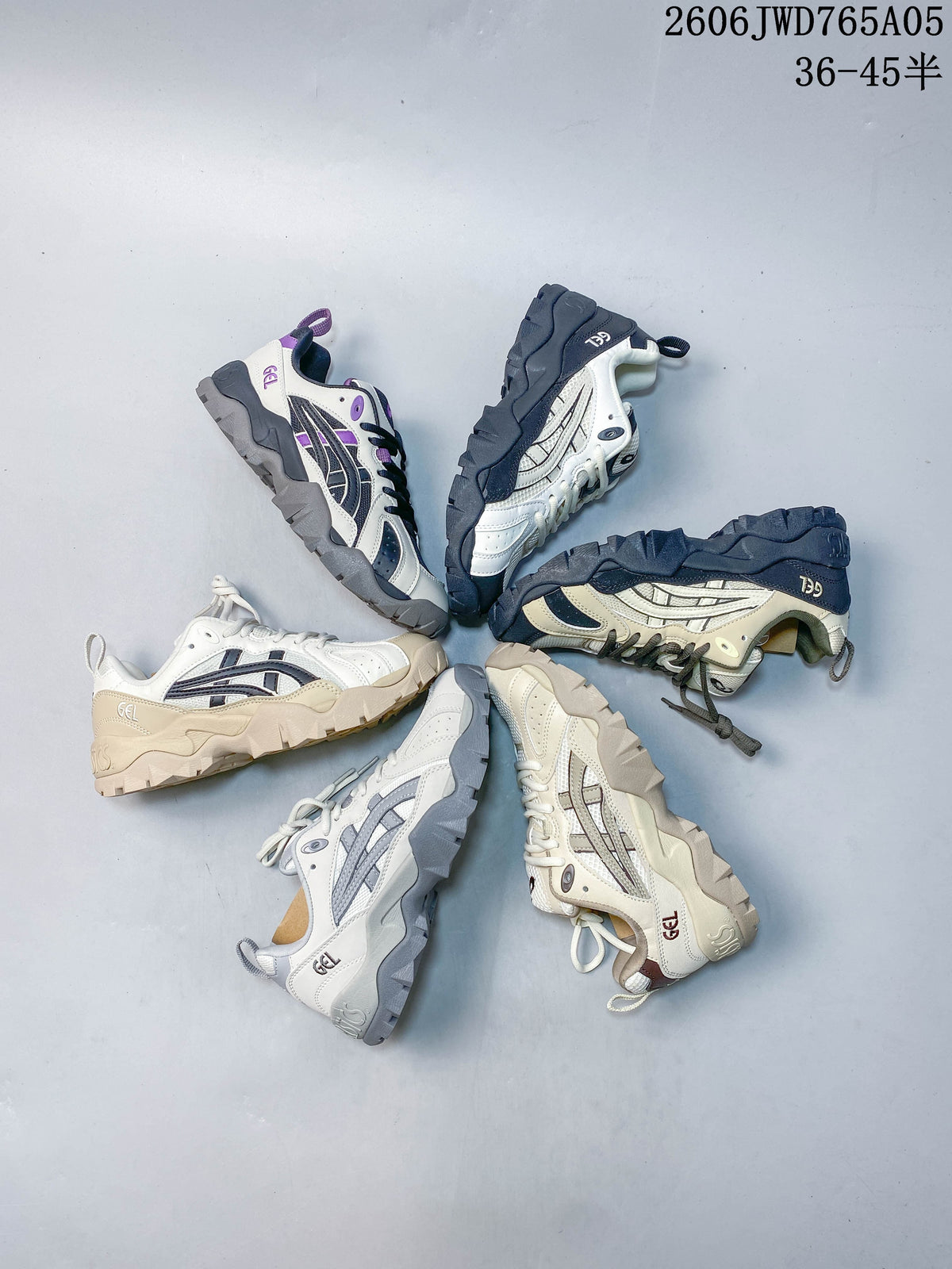 White and gray ASICS Gel-TRUCK sneaker with a thick, angular outsole.