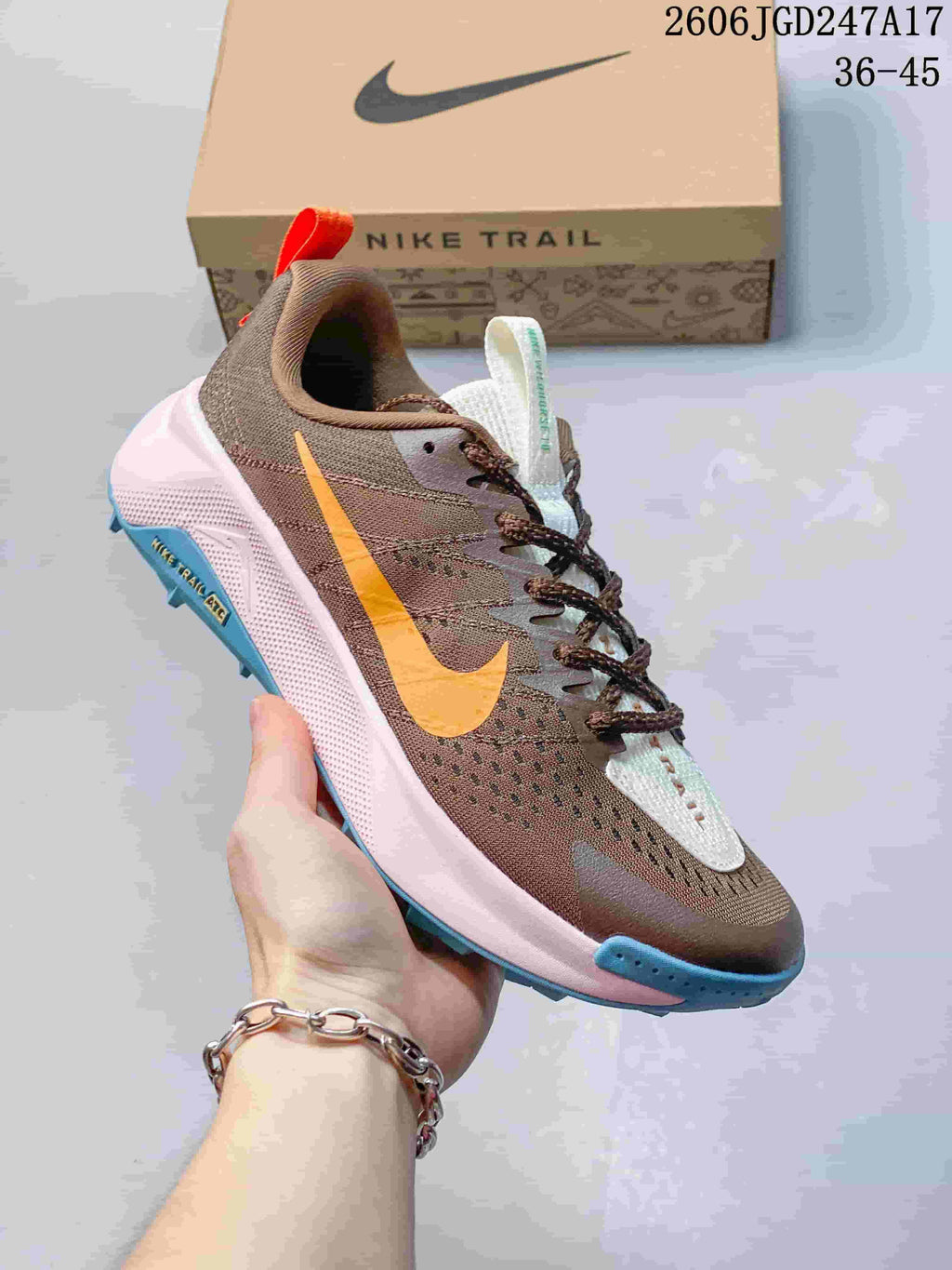 Brown Nike Wildhorse 10 trail running shoe with yellow and blue accents