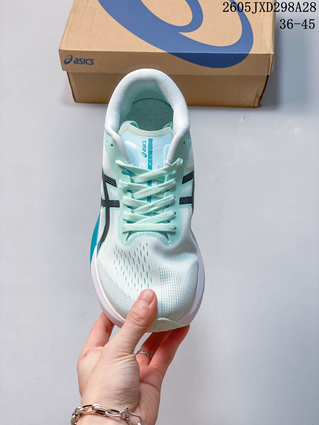 Top view of the mint lace-up running shoe