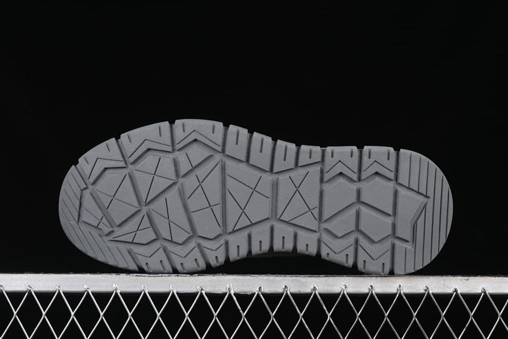 Underside view showing the geometric outsole tread