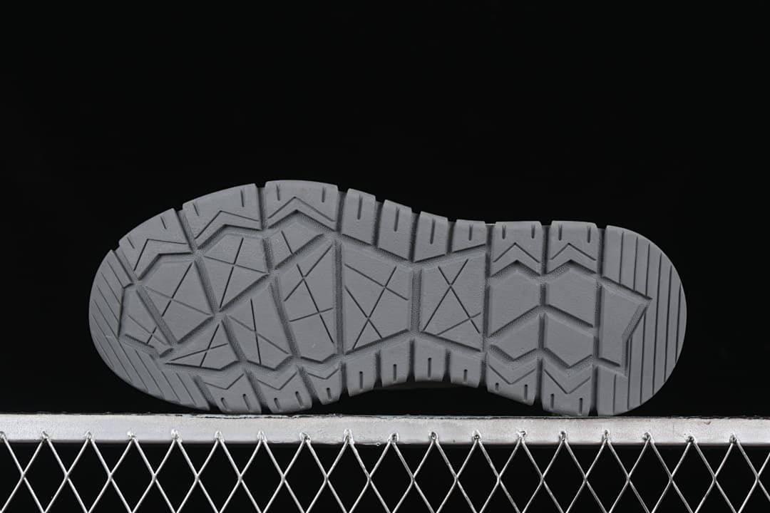 Underside view showing the geometric outsole tread