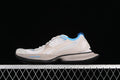 Side profile of beige and blue Balenciaga Circuit sneakers