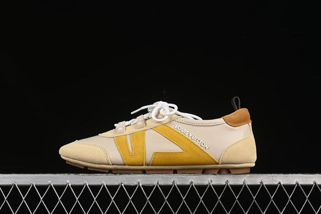 Side view of cream and mustard-yellow Louis Vuitton Sneakerina sneakers