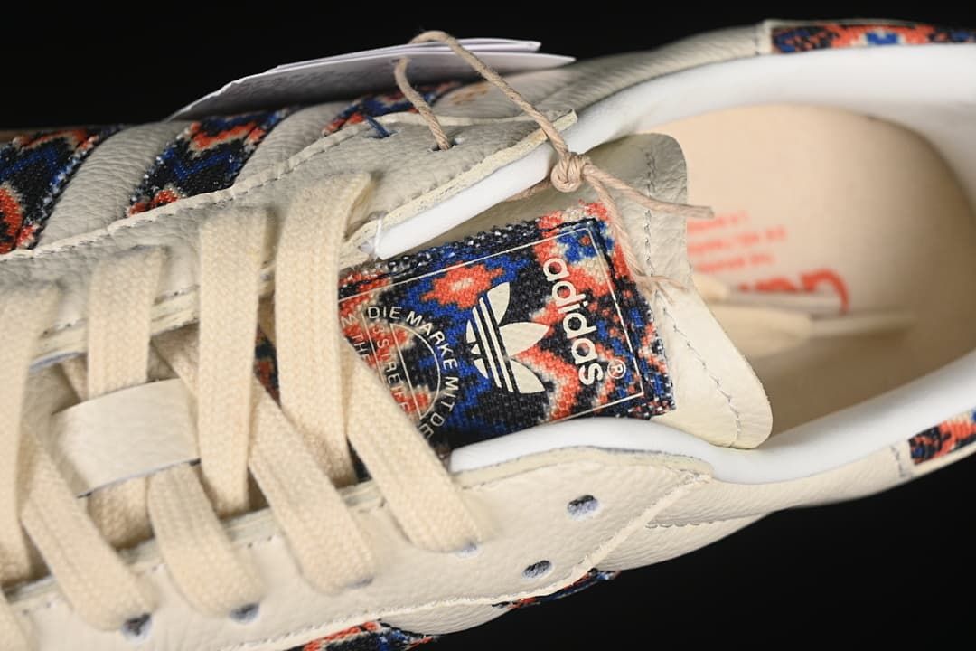 Close-up of the patterned adidas tongue label and cream laces