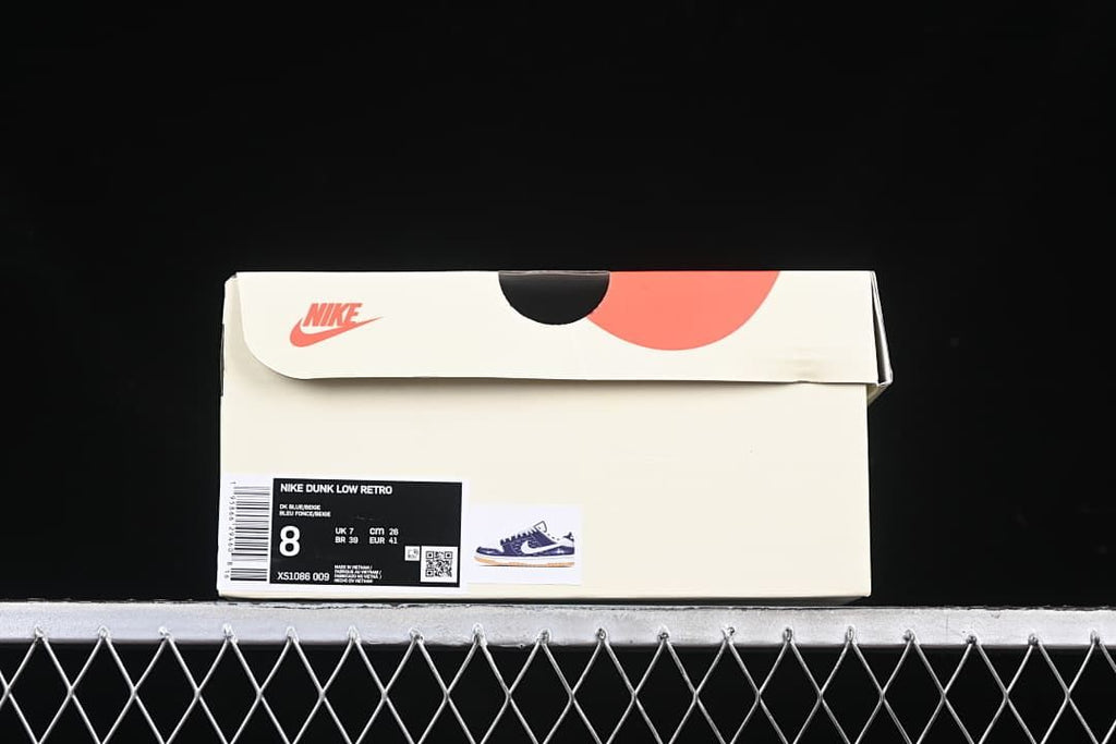 Nike Dunk Low Retro box with a label showing EU 41