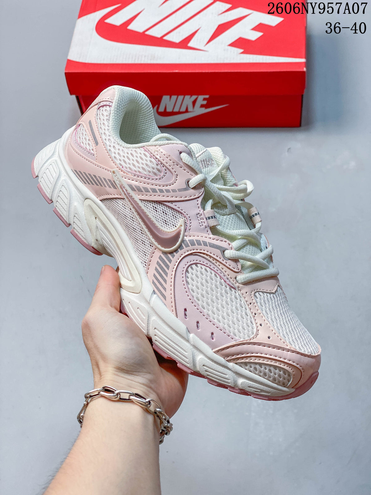Angled side view of a pale pink and white Nike V5 RNR sneaker