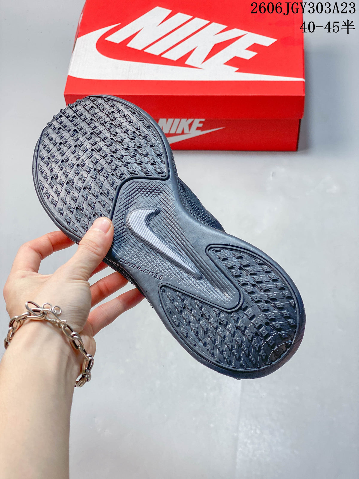 Textured outsole of a dark Nike Ava Rover shoe
