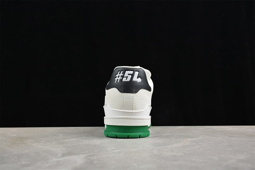 Rear view of the sneaker showing the heel detail and green outsole.