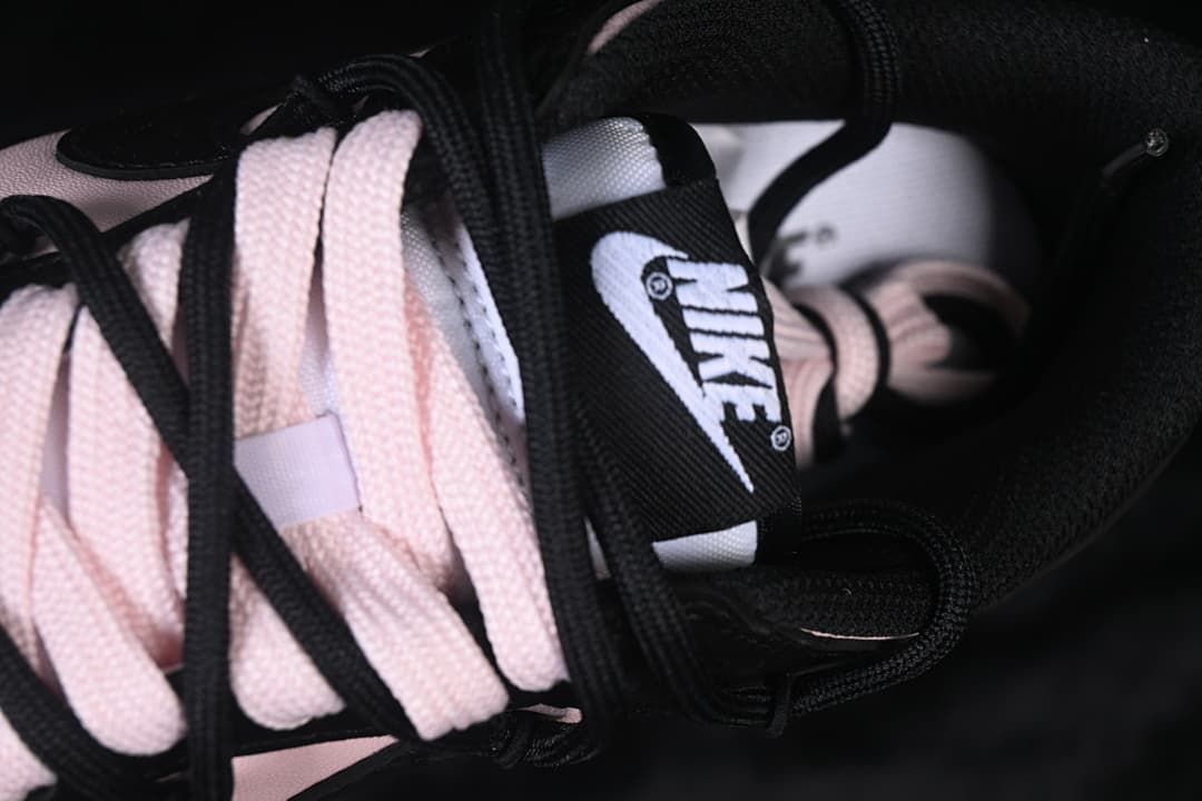 Close-up of the tongue, branding, and layered laces
