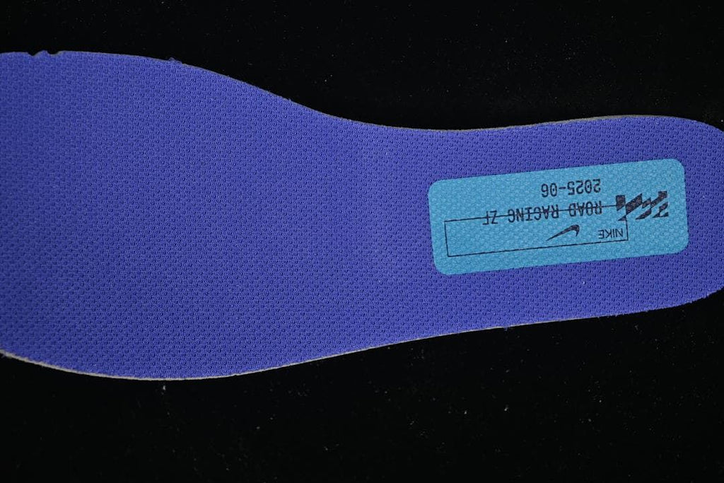 Blue shoe insert with a printed label.