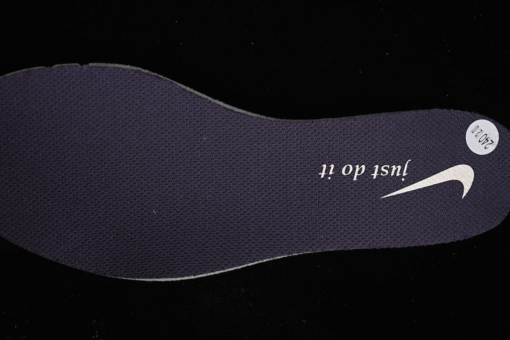 Dark shoe insole with printed branding and a round size sticker.