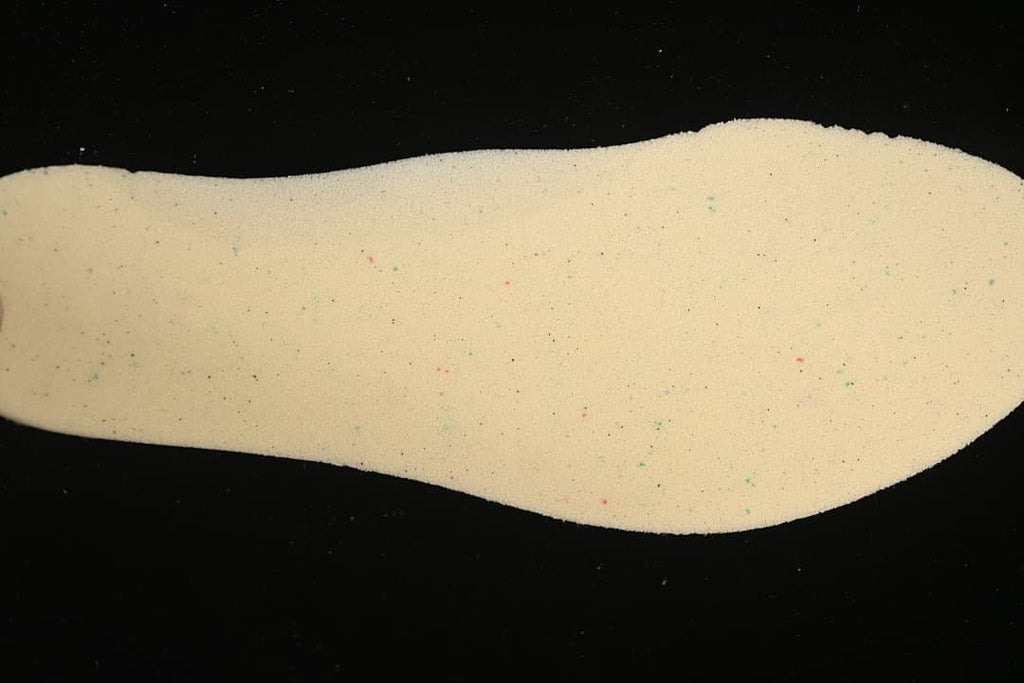 Light-colored shoe insole shown from above.