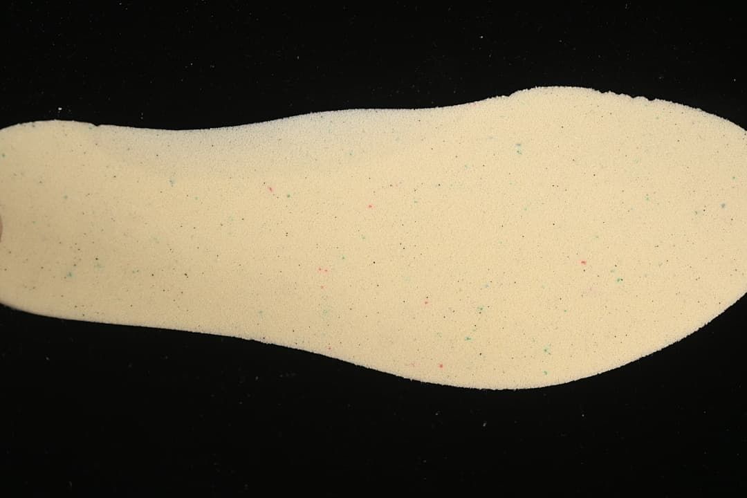 Light-colored shoe insole shown from above.
